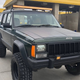 Illustration for article titled At $4,999, Does This Raised Up 1996 Jeep Cherokee Come With a Jacked Up Price?em/em